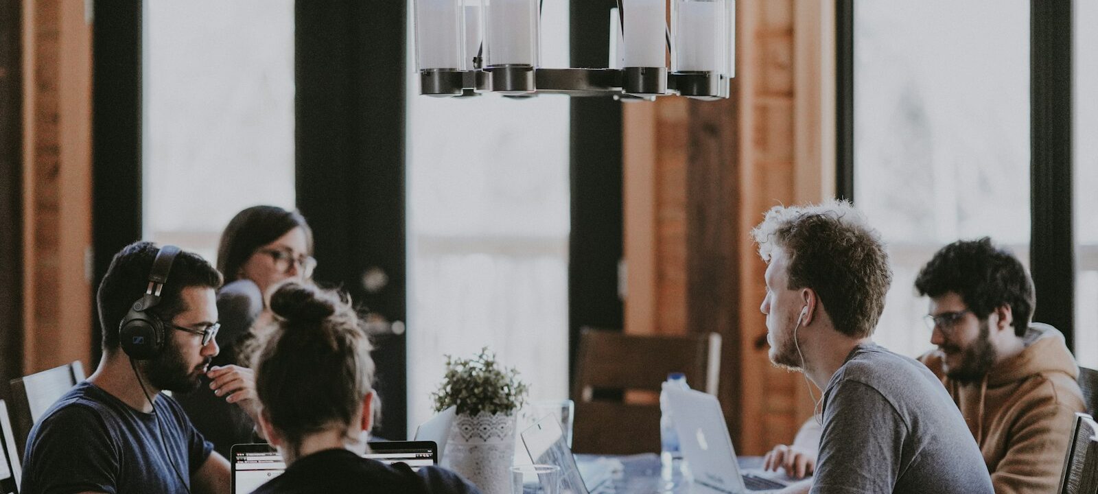 Business team discussing an agreement around a meeting table